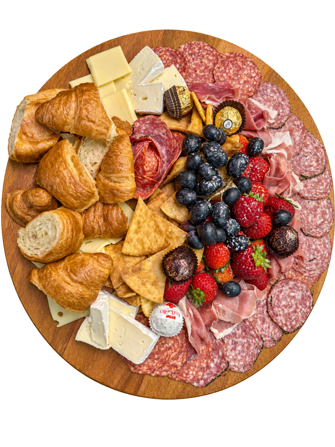 Charcuterie board with croissants, cheeses, cured meats, and chocolate